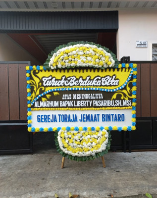 Papan Bunga Duka di Wayame